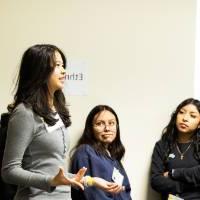 Girls of Color Summit previous event with a group having a discussion